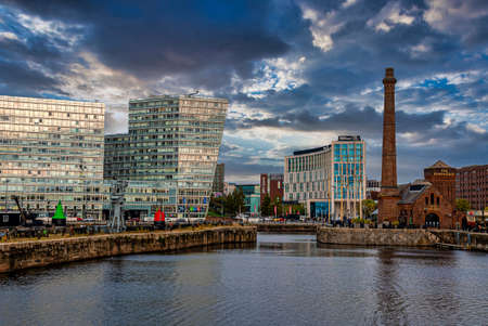 Liverpool waterfront with modern city buildings against cloudy skyの素材 [FY310177874592]