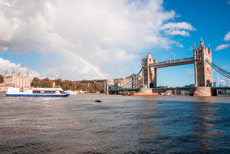 Beautiful view of the Tower bridge in London with a full rainbow over itの写真素材