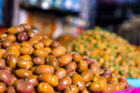 Pile of argan nuts and seeds for selling on street marketplace