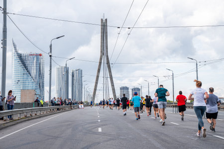 Runners crossing Riga streets during Tet Riga Marathon.の写真素材