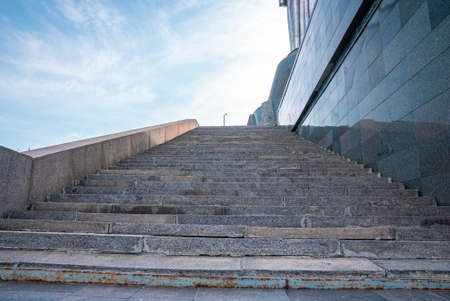 Empty granite staircases beside historical motherland monument sculpture