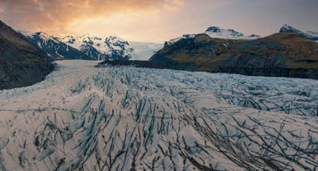 Beautiful glaciers flow through the mountains in Iceland.の写真素材