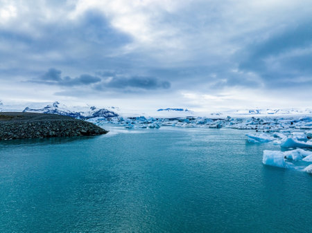 Scenic view of icebergs in Jokulsarlon glacier lagoon, Iceland, at dusk.