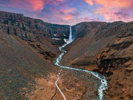 Aerial view on Hengifoss waterfall with red stripes sediments in Iceland.の写真素材