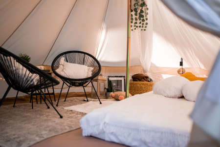 Picnic in the nature, table, carpets, wigwam, tent, pillows in the park.の写真素材