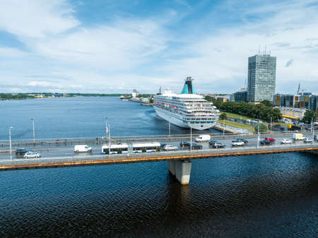 Beautiful cruise ship docked in Riga, Latvia near the old town and the bridge.の写真素材
