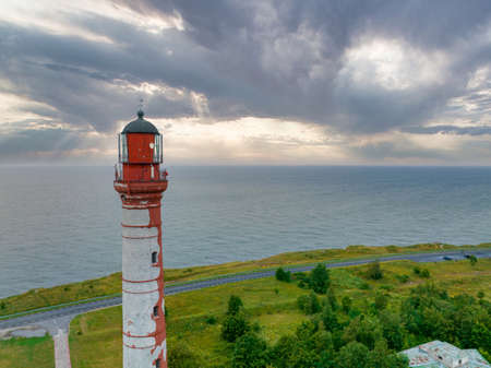 Beautiful limestone cliff on Pakri peninsula, Estonia with the historic lighthouses.の写真素材