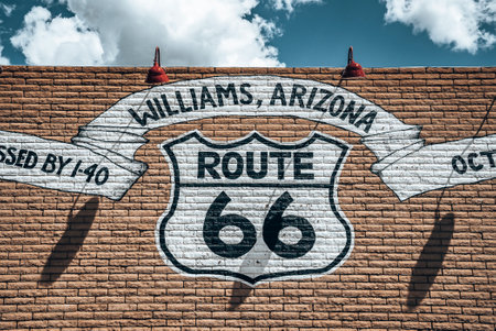 Information text painted on brick wall with sky in background on sunny dayの写真素材
