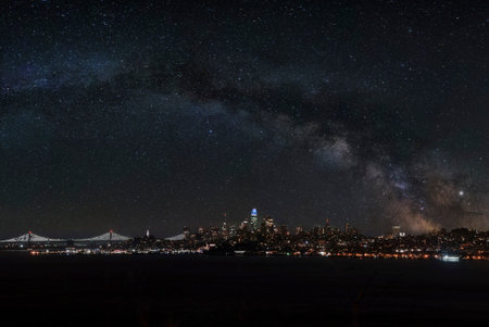 Illuminated cityscape in front of San Francisco bay at nightの写真素材