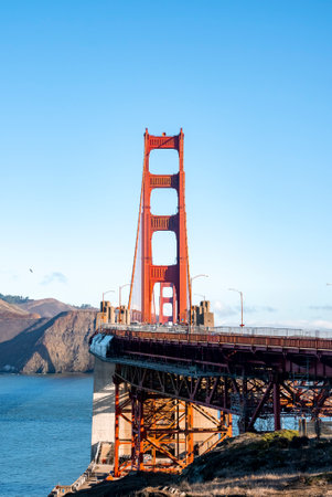 Historic Golden Gate Bridge over San Francisco Bay during sunny dayの写真素材
