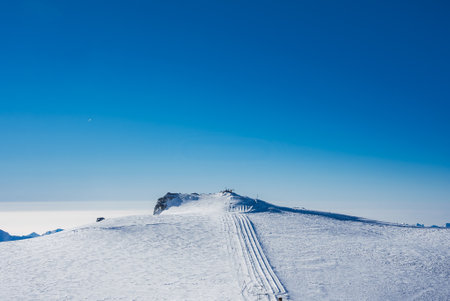 Ski slope and snow covered winter mountains. Matterhorn is a mountain in the Pennine Alpsの写真素材