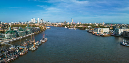 Beautiful panoramic view of London Thames river with Canary Wharf skyline on the horizon.の写真素材