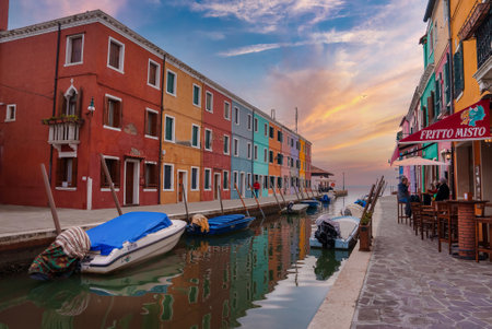 Tranquil Canal Scene with Colorful Buildings in Burano, Italy - Venetian Charm and Architectureの写真素材