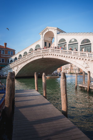 Iconic Rialto Bridge in Venice, Italy: A bustling landmark for tourists and localsの写真素材