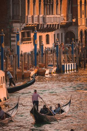Tranquil Grand Canal gondolas in Venice evoke timeless beauty and peaceful charm.