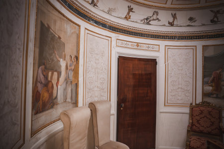 Ornate and Elegant Circular Room with Paintings and High Ceilingの写真素材