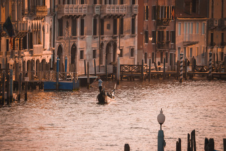 Tranquil Gondola Ride on the Water in Venice, Italy - Serene Summer Dayの写真素材