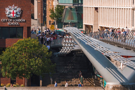 City of London School building while Tourists walking on bridge during sunny dayの写真素材
