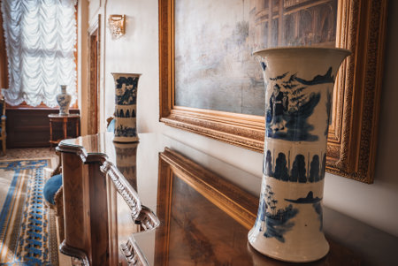 Two blue and white vases on a table in a room. No other objects are on the table.の写真素材