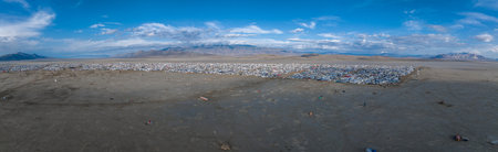 Aerial view of the festival in a desert with beautiful art installations and people walking around the desert.の写真素材
