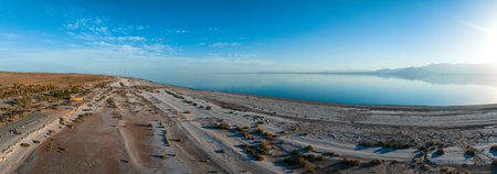 Aerial view over Salton sea in California. Huge lake in the middle of a desert at sunset.の写真素材