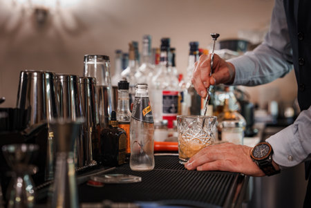 Venetian Mixology: Bartender Crafting a Drink in a Sophisticated and Relaxed Bar Atmosphereの写真素材