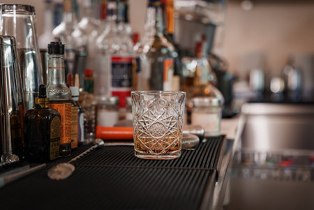 Elegant and Minimalist Empty Glass on Bar Counter with Copy Space for Text or Design