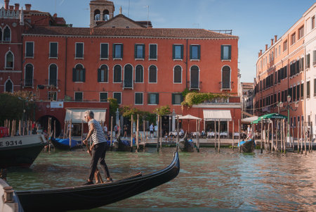 Serene Gondolas Gliding on Grand Canal in Venice, Italy - Tranquil Water Sceneの写真素材