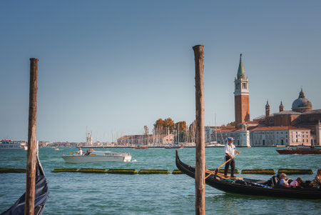 Traditional black gondolas on the Grand Canal in Venice, Italy with no visible peopleの写真素材