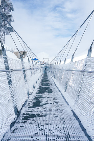Winters Suspension Bridge at Engelberg Ski Resort, Switzerland, is scenic.の写真素材