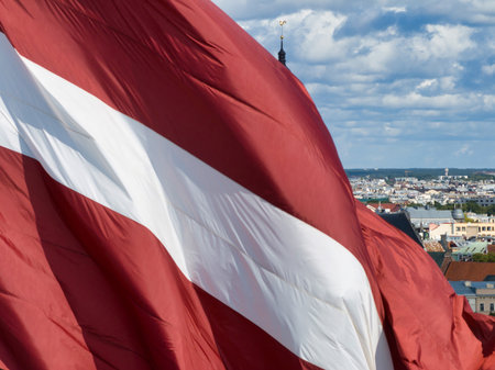 Panorama of Riga city with a big Latvian flag in foreground
