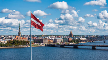 Panorama of Riga city with a big Latvian flag in foreground
