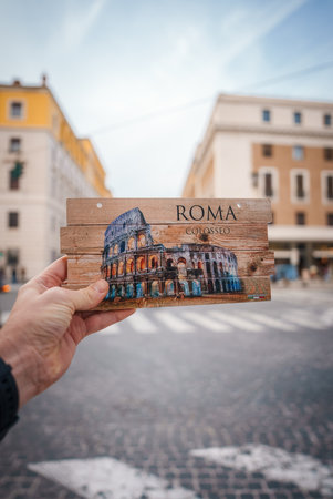 Wooden postcard with Colosseum in Rome souvenir, street scene backgroundの写真素材