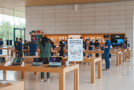 Modern Apple Store interior, Mountain View, CA sleek design, products, customers, employees.