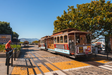 Vibrant Scene Featuring Iconic Cable Cars at Fishermans Wharf in San Francisco
