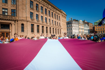 Crowd celebrates Latvias EU milestone in historic Riga squareの写真素材