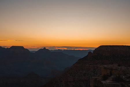 Serene Sunset View Over Vast Canyon, Grand Canyon Twilight Silhouette, Natural Beauty.の写真素材