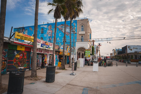 Vibrant street scene in Venice Beach, Los Angeles. Pedestrian friendly with colorful storefronts,...