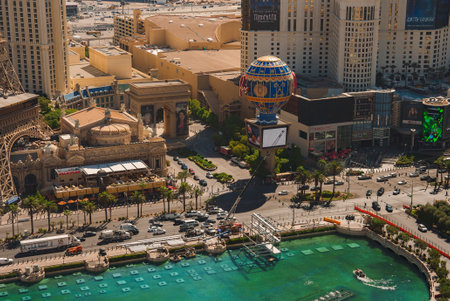Aerial view of bustling Las Vegas Strip with Eiffel Tower replica and palm trees in daylightの写真素材