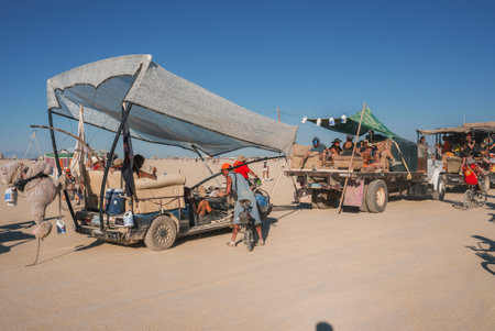 Desert Music and Art Festival Scene with Unique Vehicle and Relaxed Attendees, Eclectic Vibeの写真素材