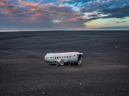 Wrecked old plane Dakota on the black sand beach, south coast of Icelandの写真素材