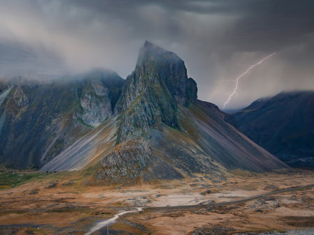 Lightning Strike Illuminates Dramatic Mountain Range in Icelandの写真素材