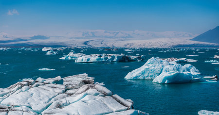 Aerial view of the big pieces of ice from glacier, ice islands, glacier and mountains, Jokulsarlonの写真素材
