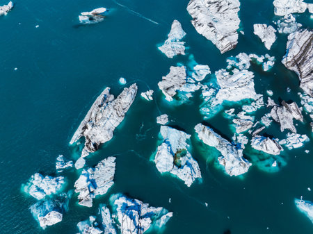 Aerial View of Turquoise Waters with White Ice Formations in Icelandの写真素材