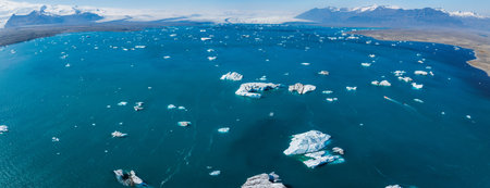 Aerial View of Calm Blue Waters with Icebergs in Icelands Serene Landscape