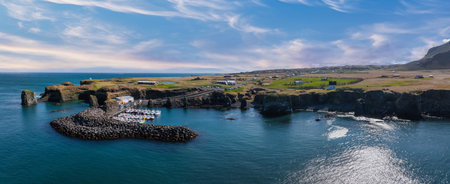 Aerial View of Rocky Icelandic Coastline with Harbor and Boats Docked
