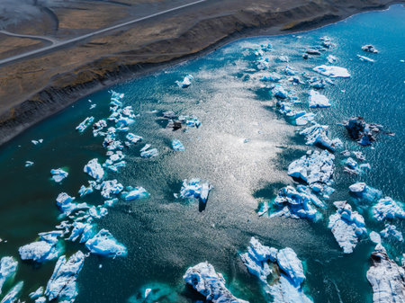 Aerial View of Glacial Lagoon with Icebergs in Deep Blue Waters, Iceland