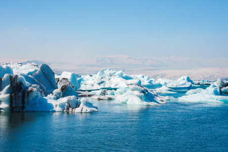 Jokulsarlon Glacier Lagoon with Floating Icebergs and Snow-Capped Mountains
