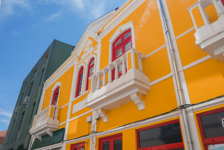 Vibrant Yellow Building with Ornate Details in Aveiro, Portugal