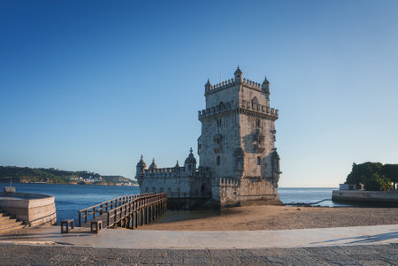 Belem Tower in Lisbon, Portugal with Clear Blue Sky and Calm Watersの写真素材